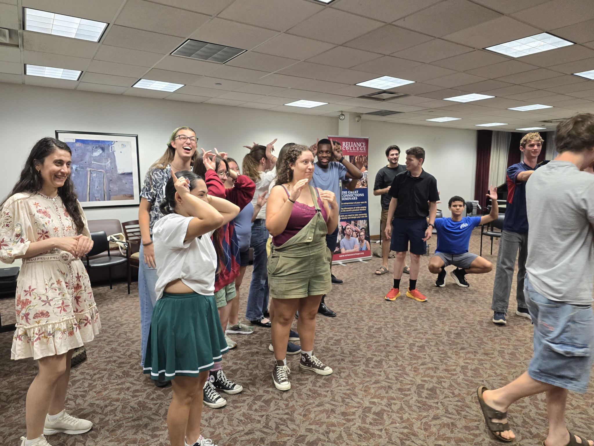 Students in a circle during an improv exercise at the Great Connections Summer Seminar.